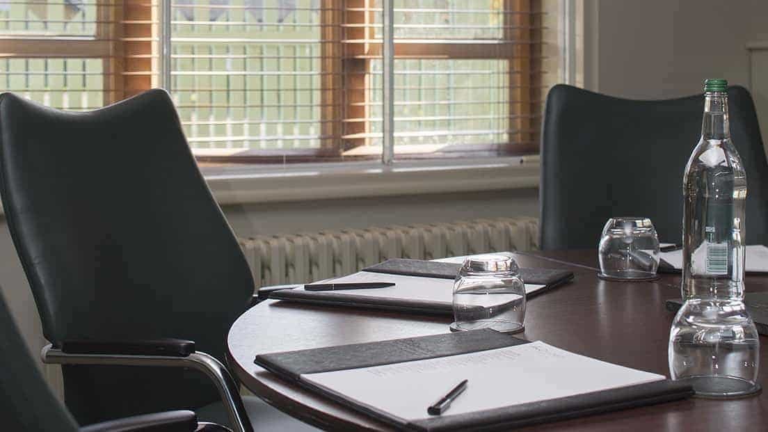 Godstone Room at Nutfield Priory: round table meeting space for productive discussions.