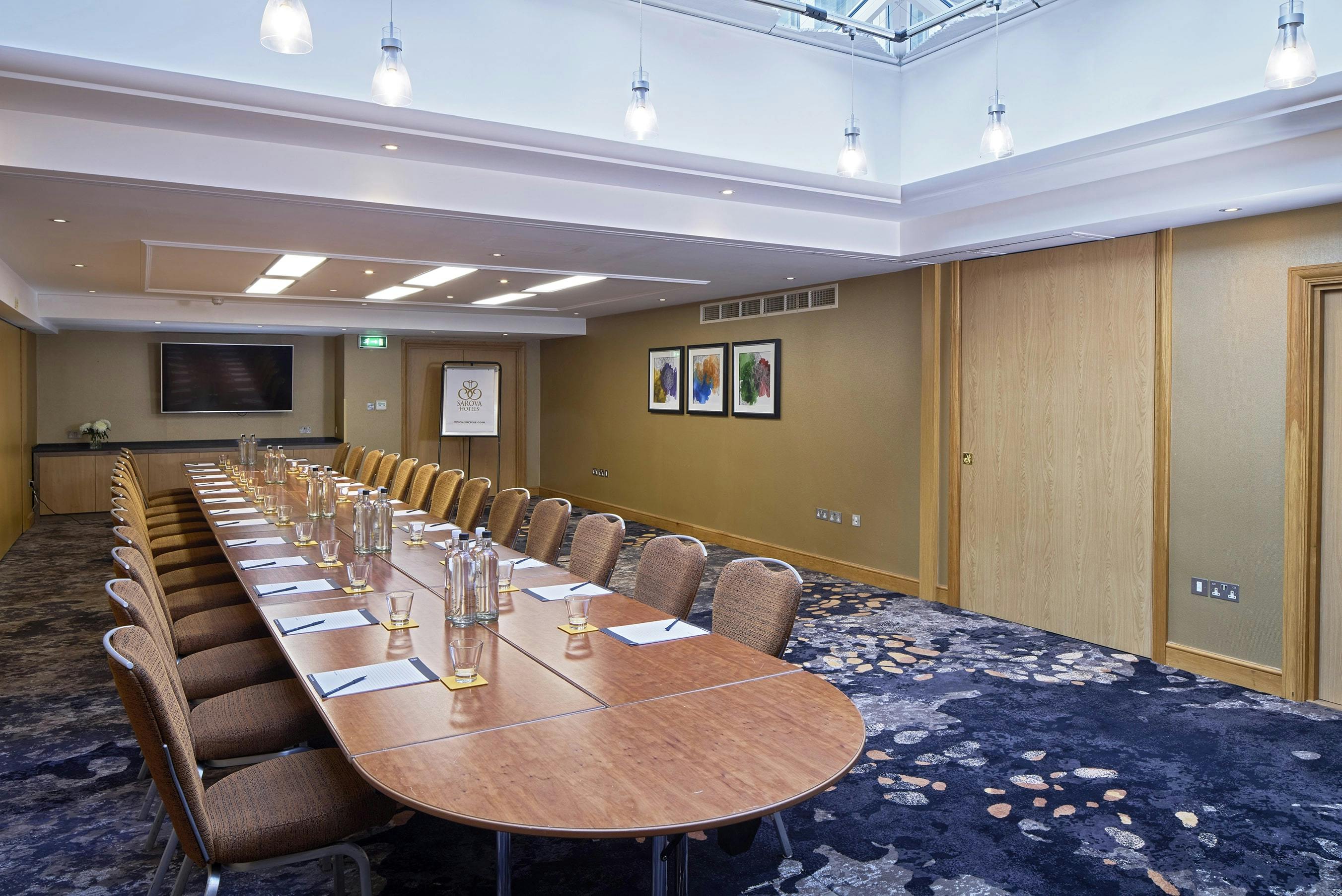 Buckingham Suite meeting room with modern decor, ideal for professional gatherings and presentations.