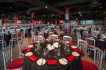 Carlsberg Dugout Liverpool: elegant dinner setup with round tables for events and networking.