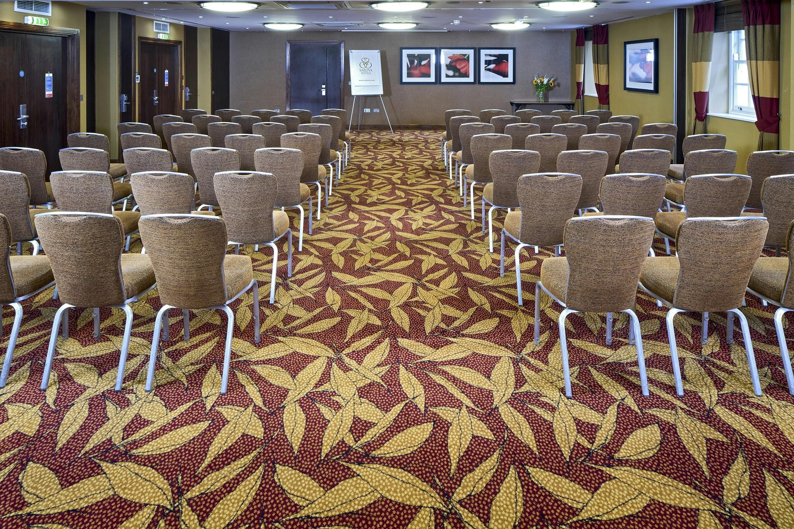 Chalfont Suite meeting space with arranged chairs, ideal for workshops and presentations.