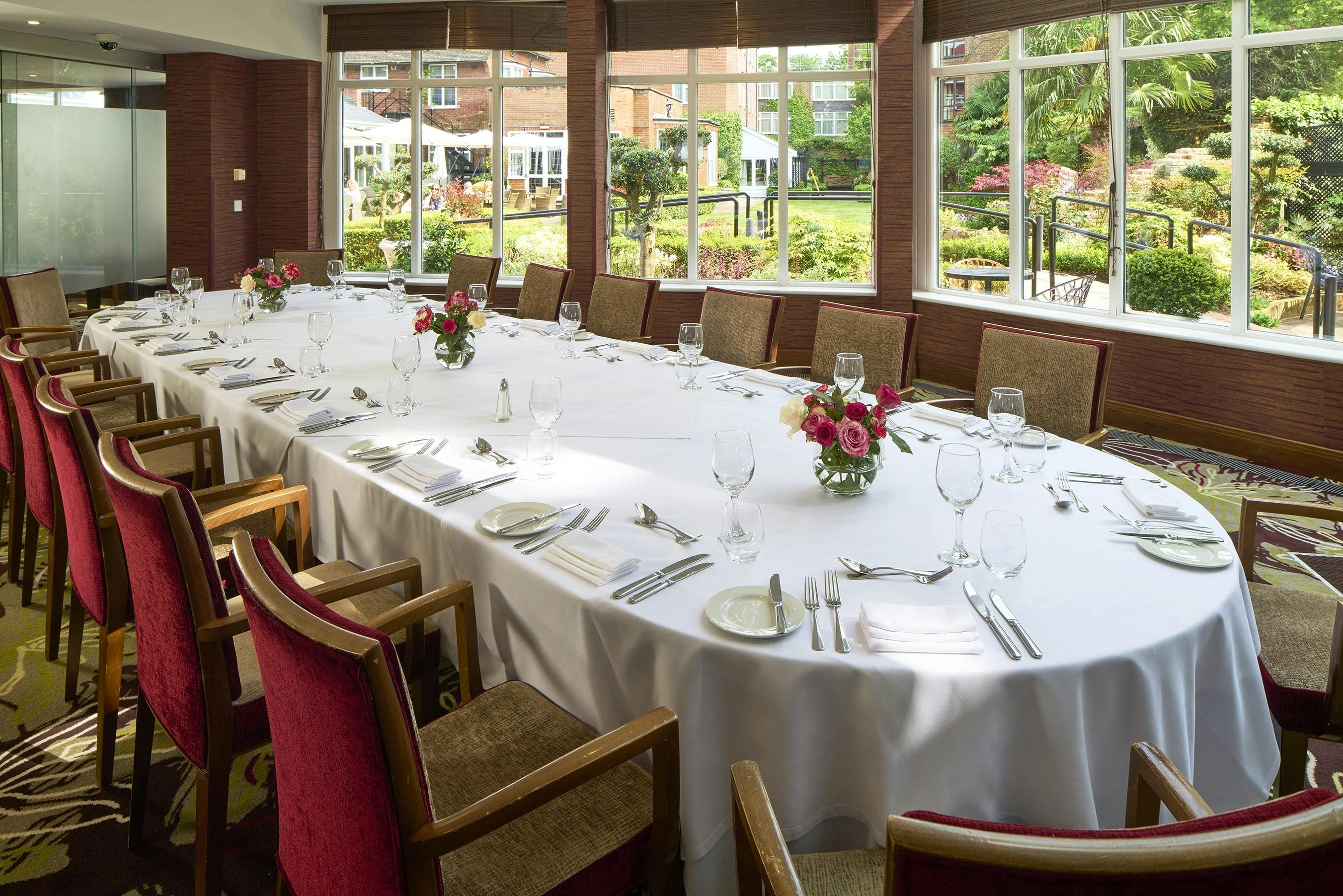 Elegant banquet setup in The Bull Hotel's Garden Room for corporate events.