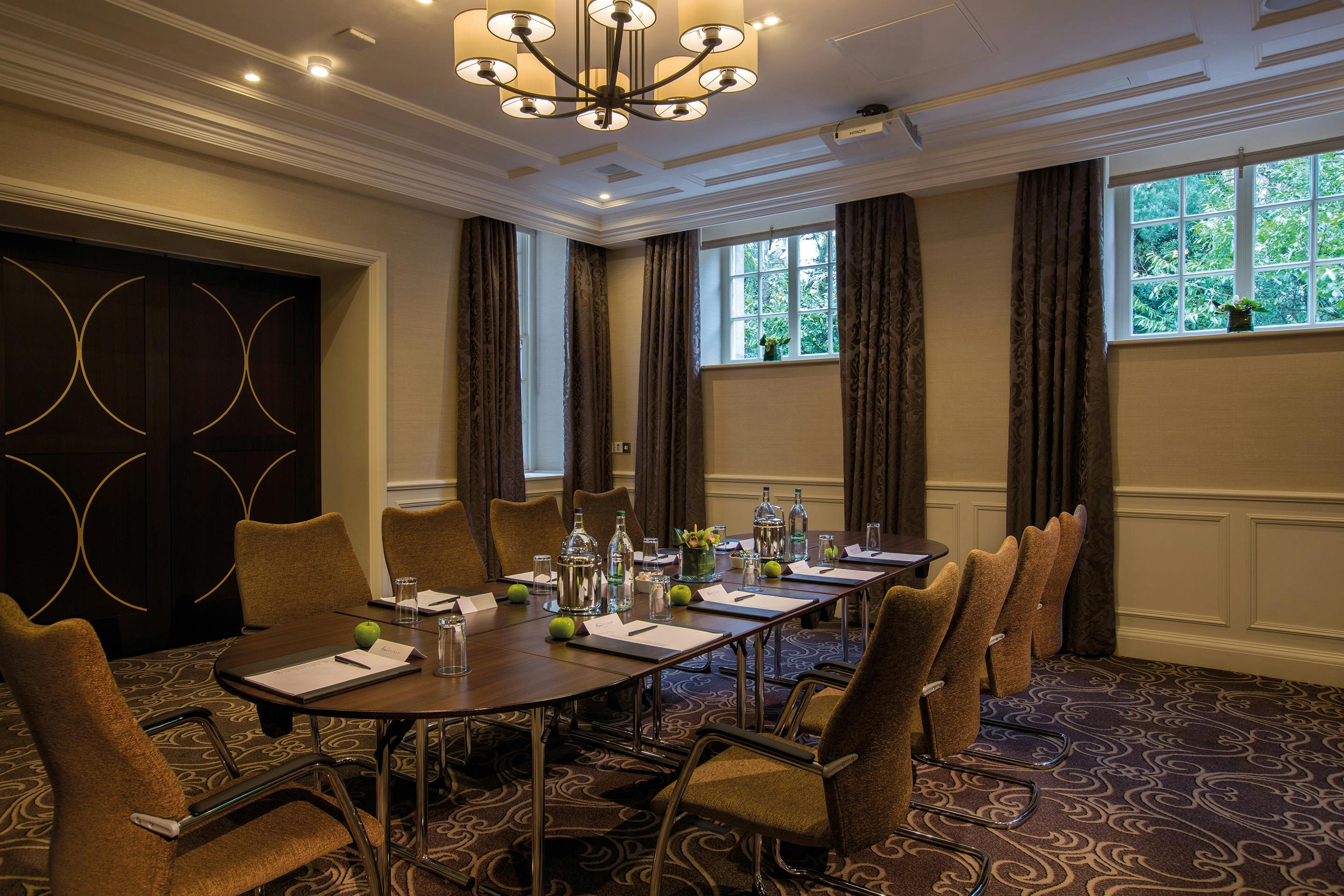 Meeting room at Crathorne Hall Hotel with oval table, ideal for workshops and executive meetings.