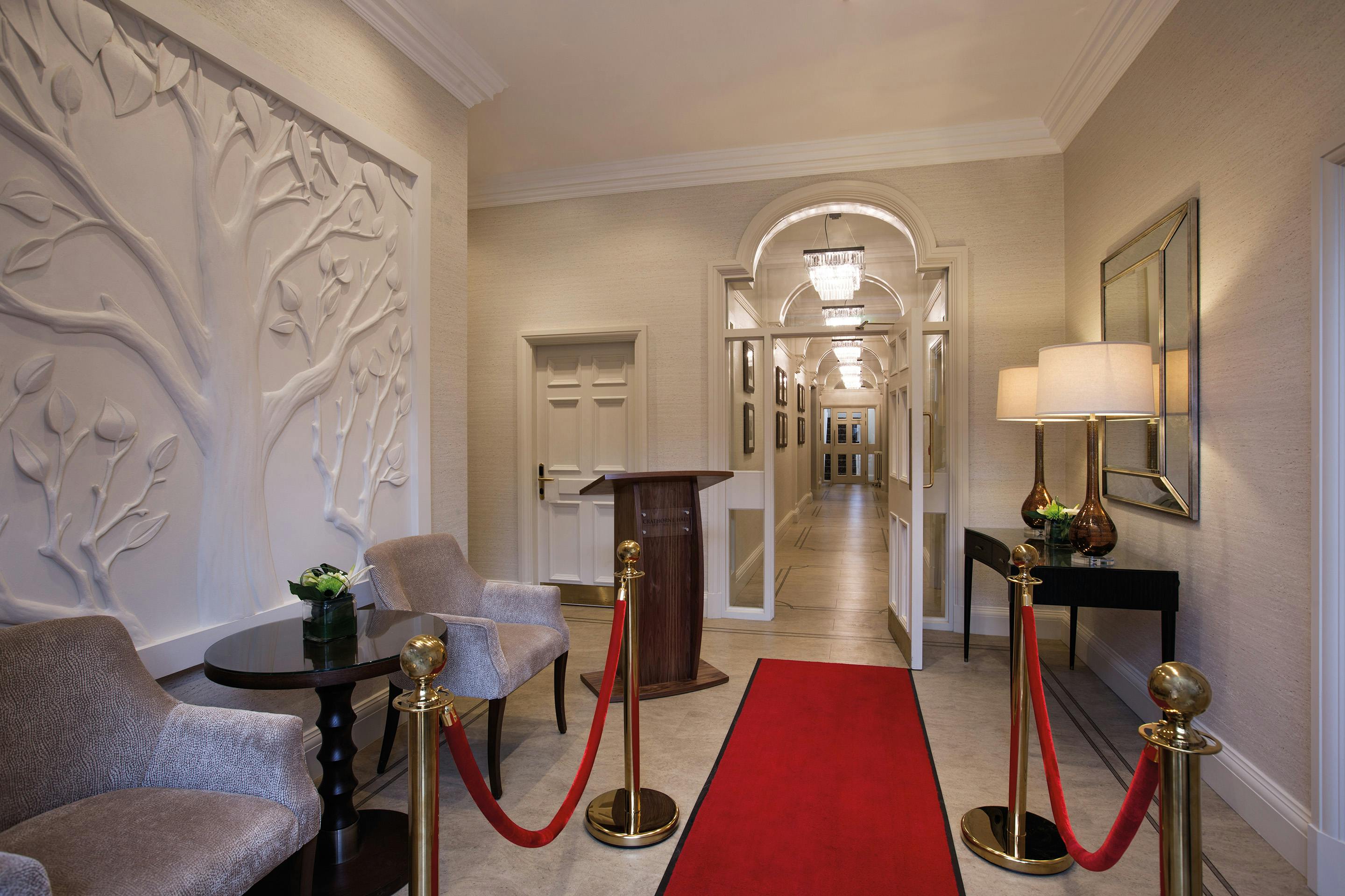 Elegant event entrance at Crathorne Hall with red carpet for corporate gala.