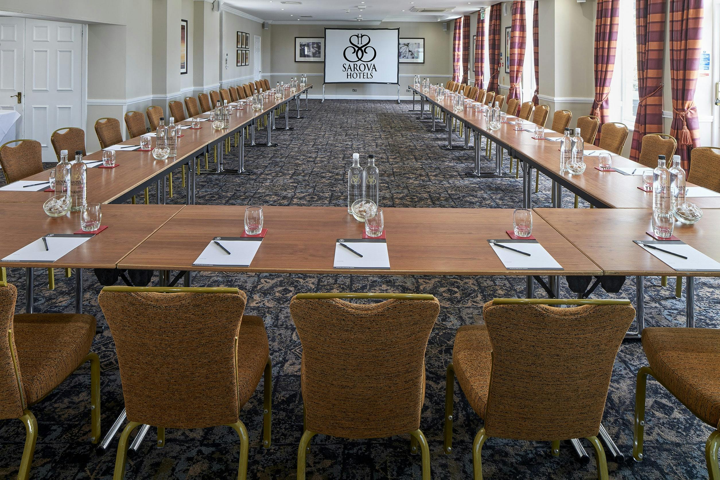 Princess Suite meeting room with U-shaped tables, perfect for corporate events and workshops.