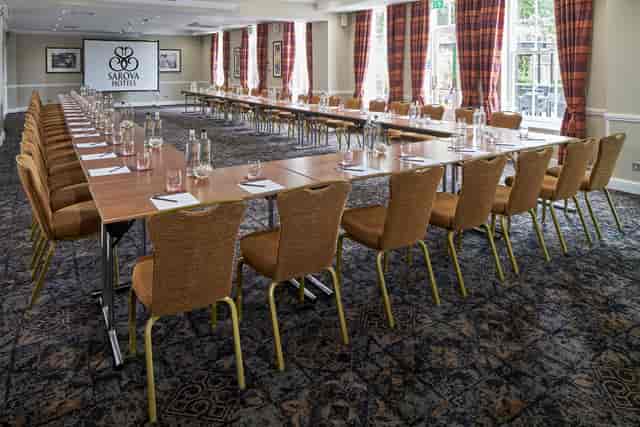 Princess Suite meeting room with U-shaped tables, perfect for corporate events and workshops.