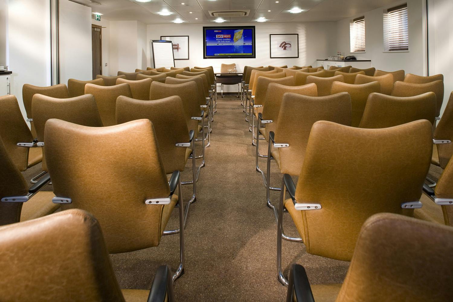 Buckingham Suite meeting room with comfortable seating for presentations and collaboration.