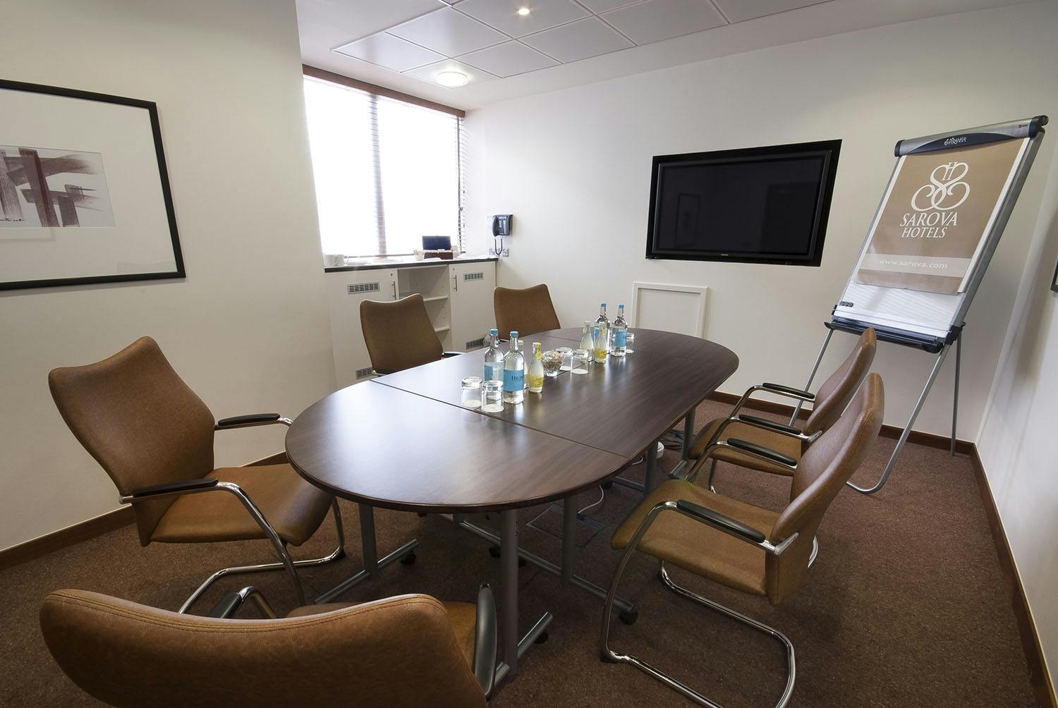 Sandringham Boardroom with sleek table, ideal for professional meetings and presentations.