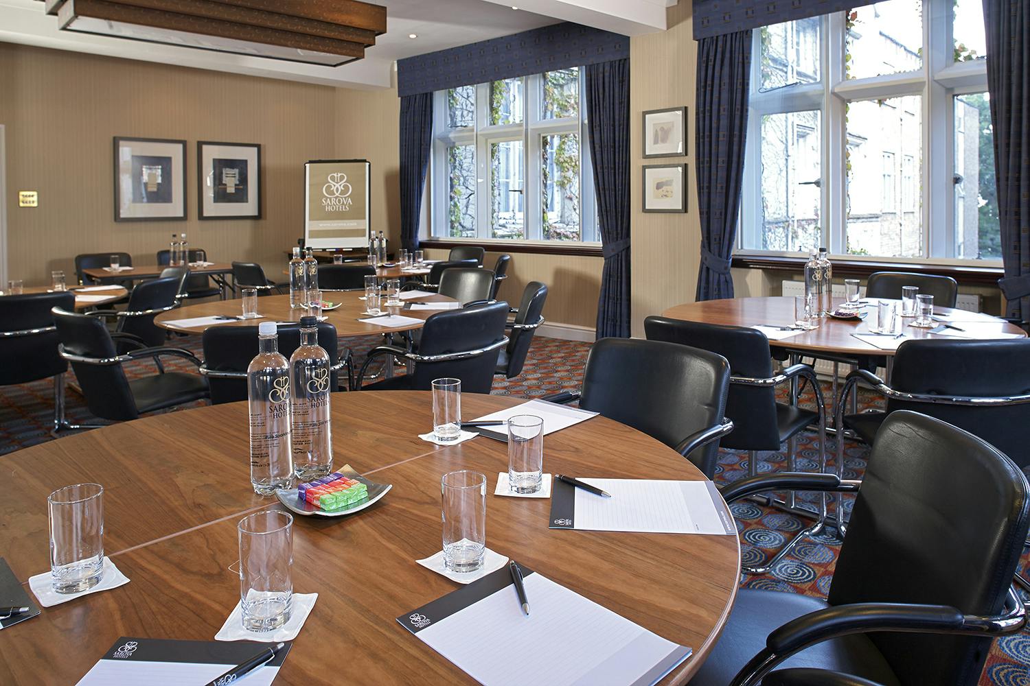 Worcester Suite meeting room with circular tables, ideal for corporate events and workshops.