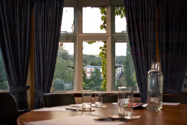 Elgar Suite meeting room with round table, ideal for corporate events and discussions.