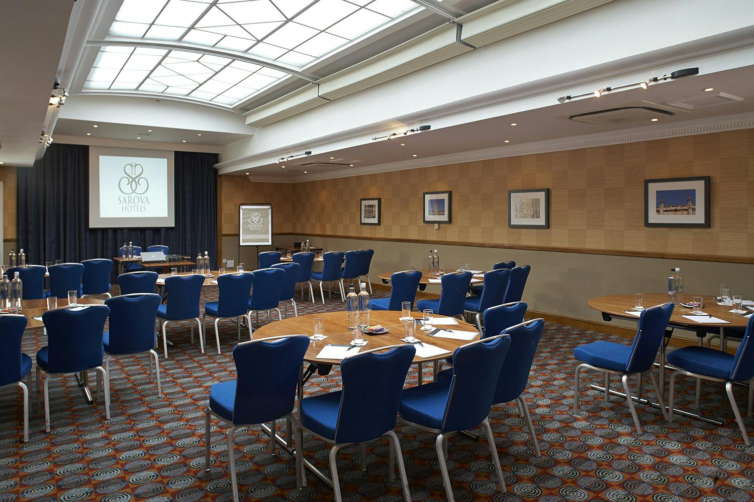 Shaw Suite at The Abbey Hotel: bright meeting room with round tables for corporate events.