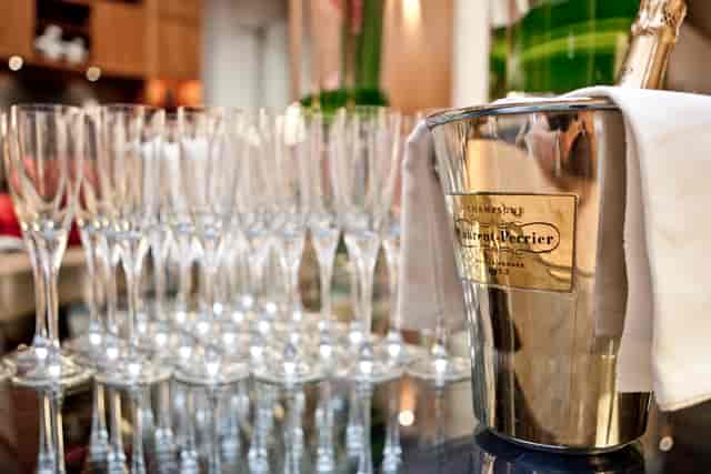 Elegant Dome Lounge setup with champagne flutes for corporate events in Threadneedles Hotel.