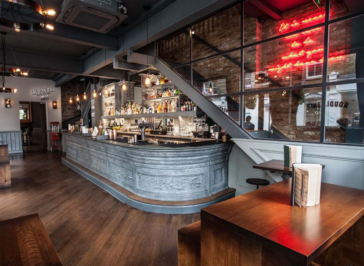 Stylish bar with curved counter, ideal for networking events and cocktail receptions.