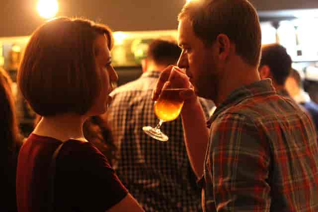 Vibrant networking event with attendees conversing in a relaxed atmosphere.