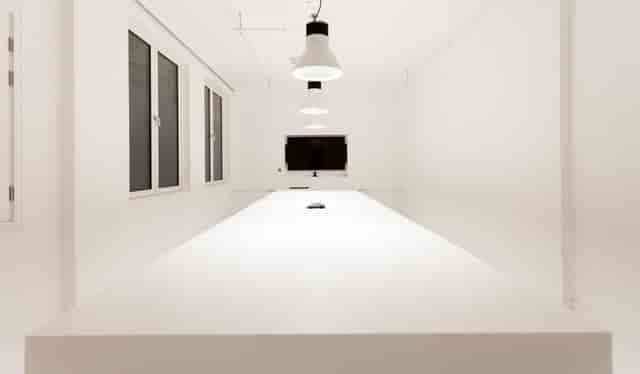 Cupertino Meeting Room with white table, ideal for modern meetings and presentations.