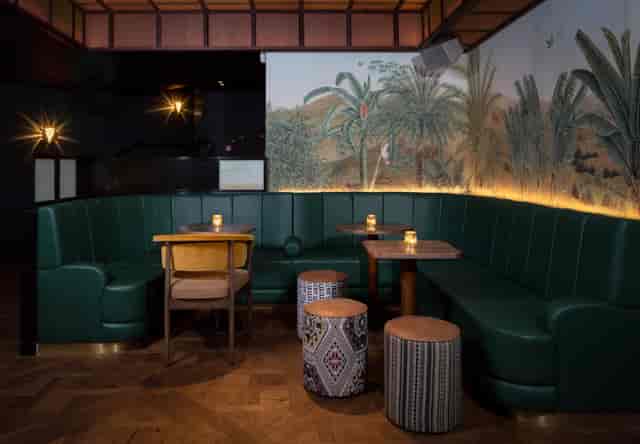 Lounge at Oriole with green banquettes for VIP receptions and corporate networking events.