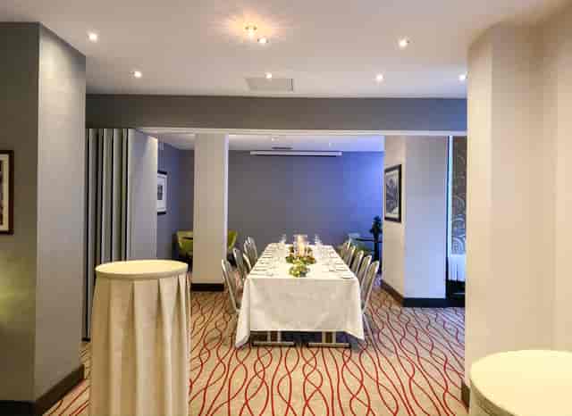 Elegant meeting space with long table, ideal for events and gatherings in Chiswell Street.
