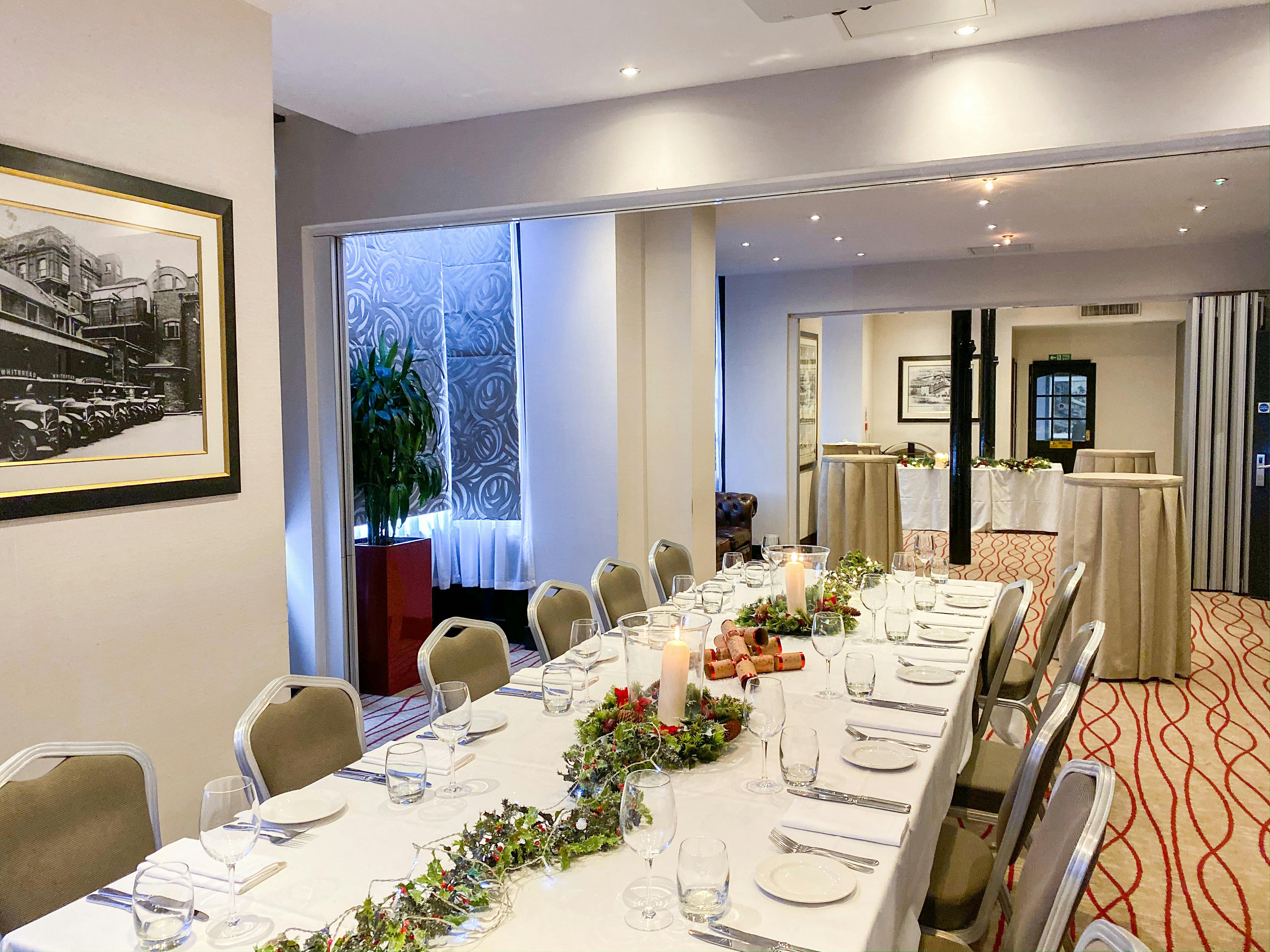 Elegant meeting space with long table, ideal for corporate events and gatherings.