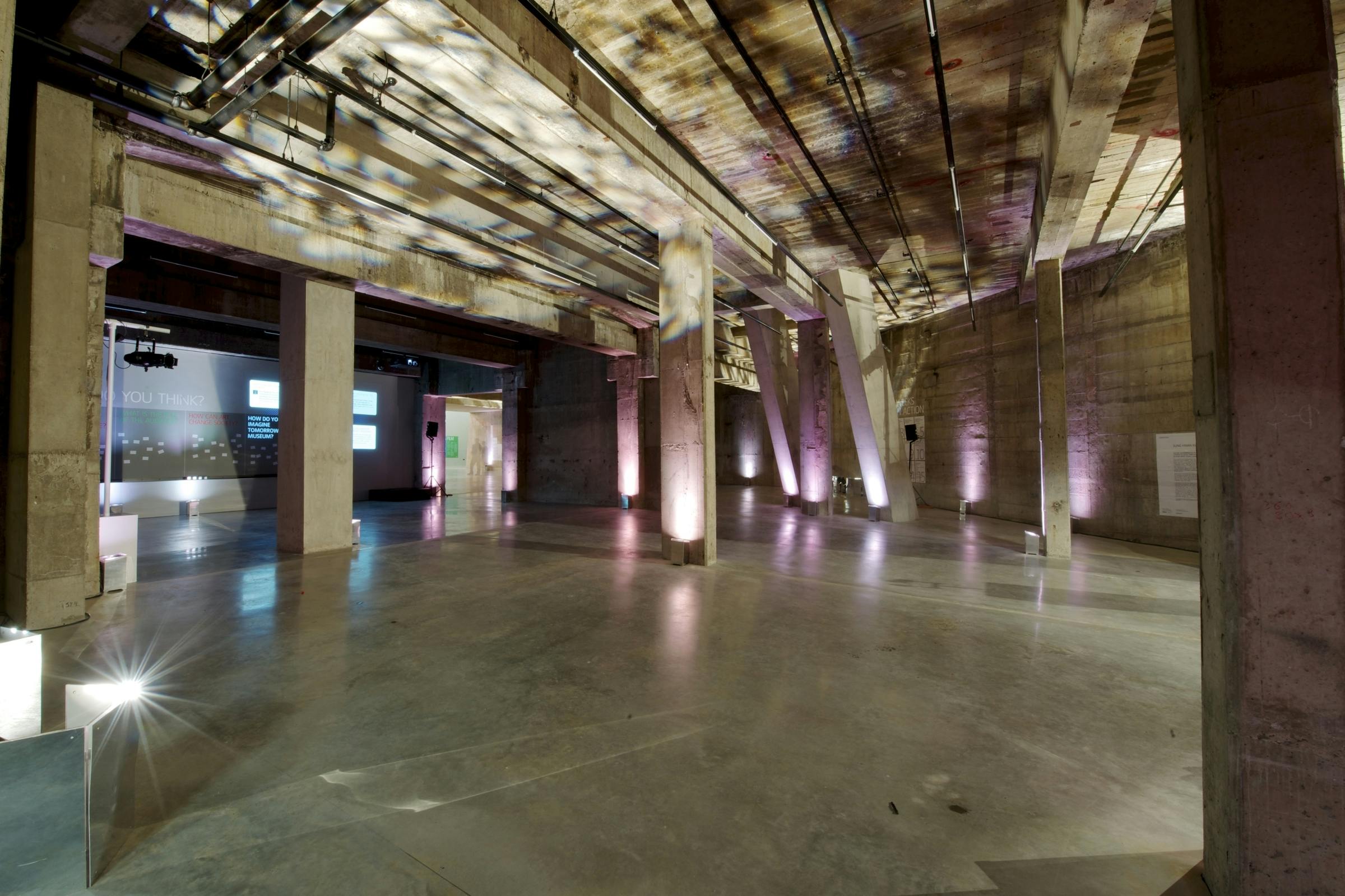 Tate Modern's Tanks Foyer: modern event space with exposed concrete, ideal for meetings and gatherings.