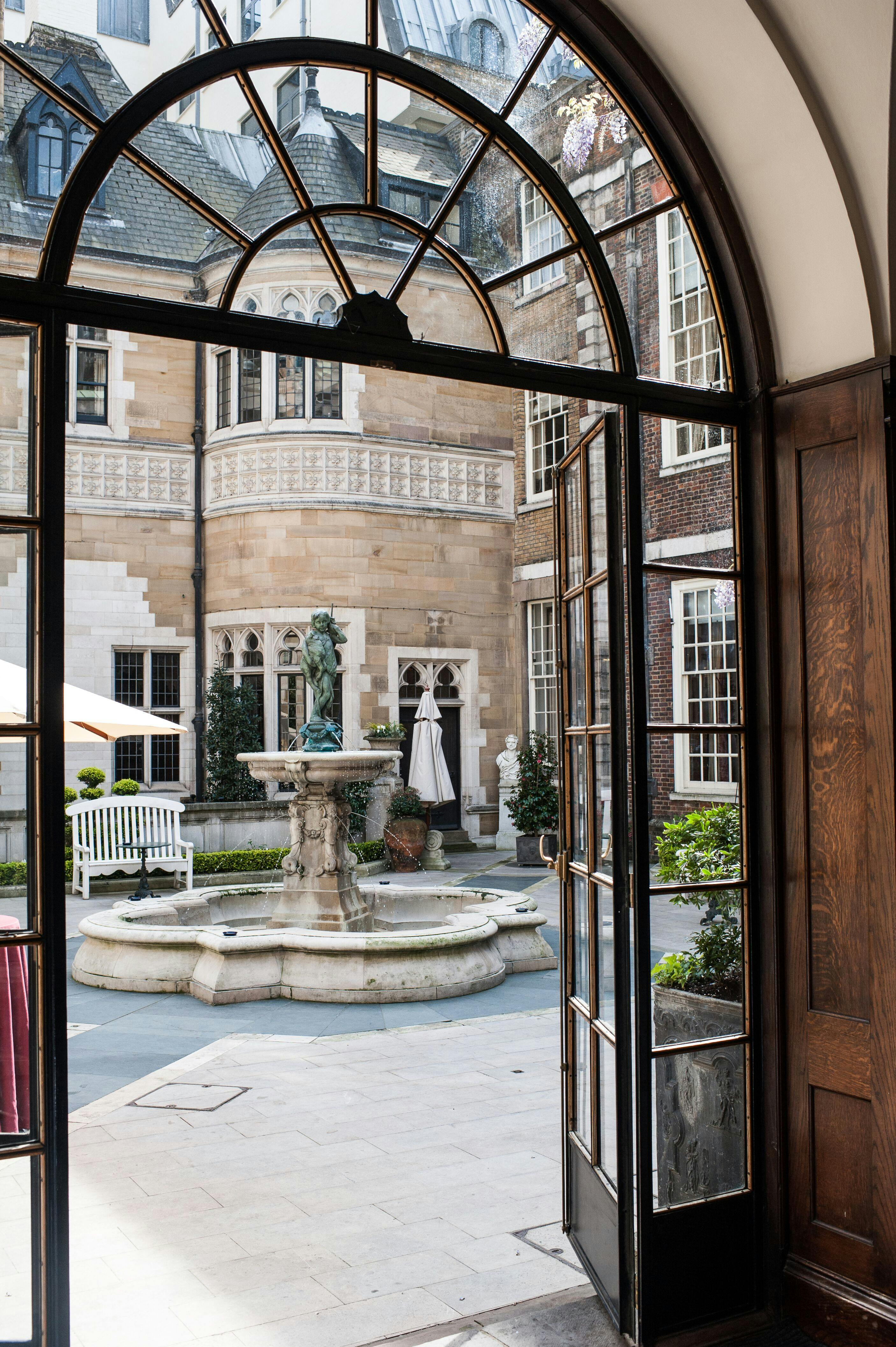 Cloisters courtyard with fountain, ideal for networking events and gatherings.