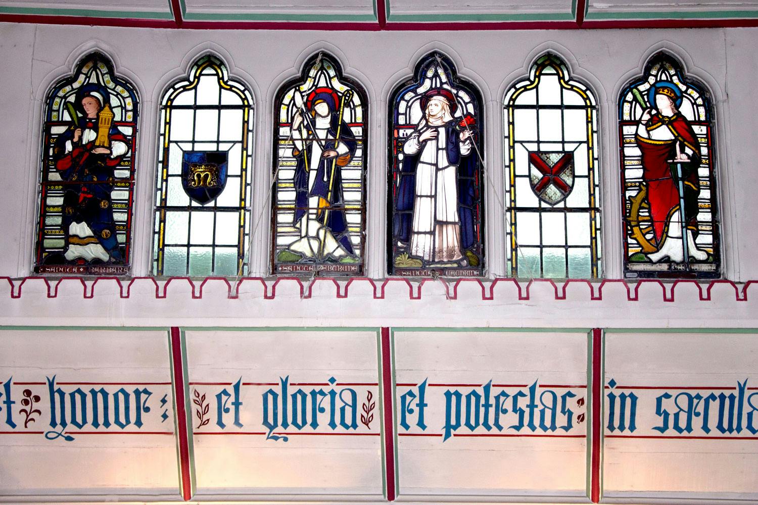Ornate stained glass windows in The Chapel, perfect for upscale events and gatherings.