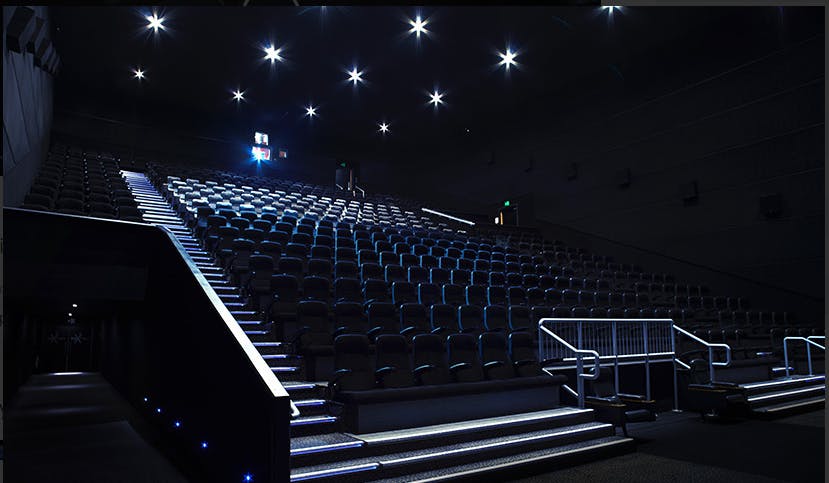 Modern auditorium with tiered seating for conferences at VUE Westfield Stratford.