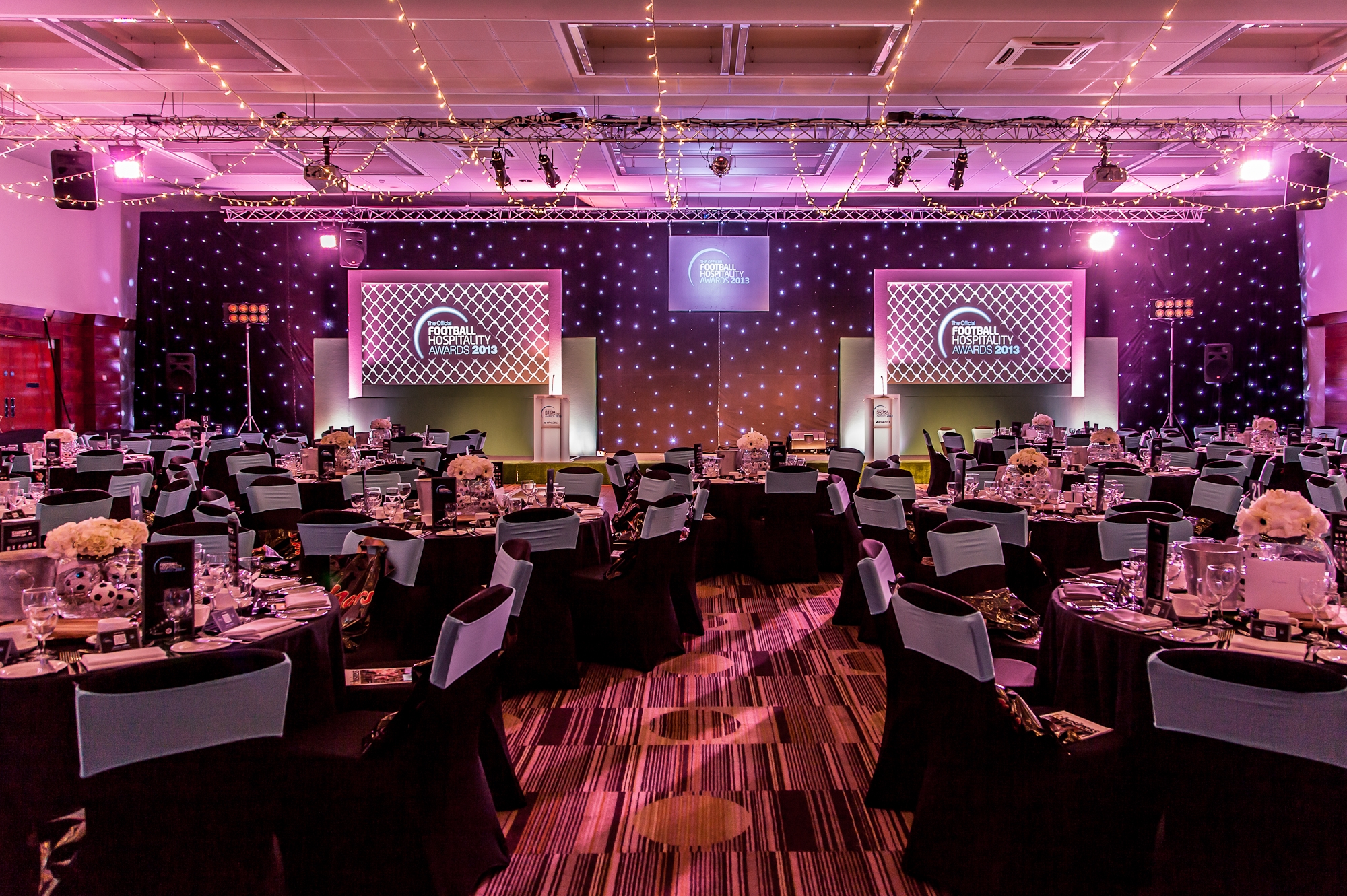 Elegant Princess Suite set for a gala event with round tables and soft lighting.