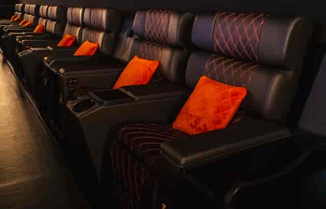 Lux Cinema screening room with premium recliners for VIP presentations and corporate events.
