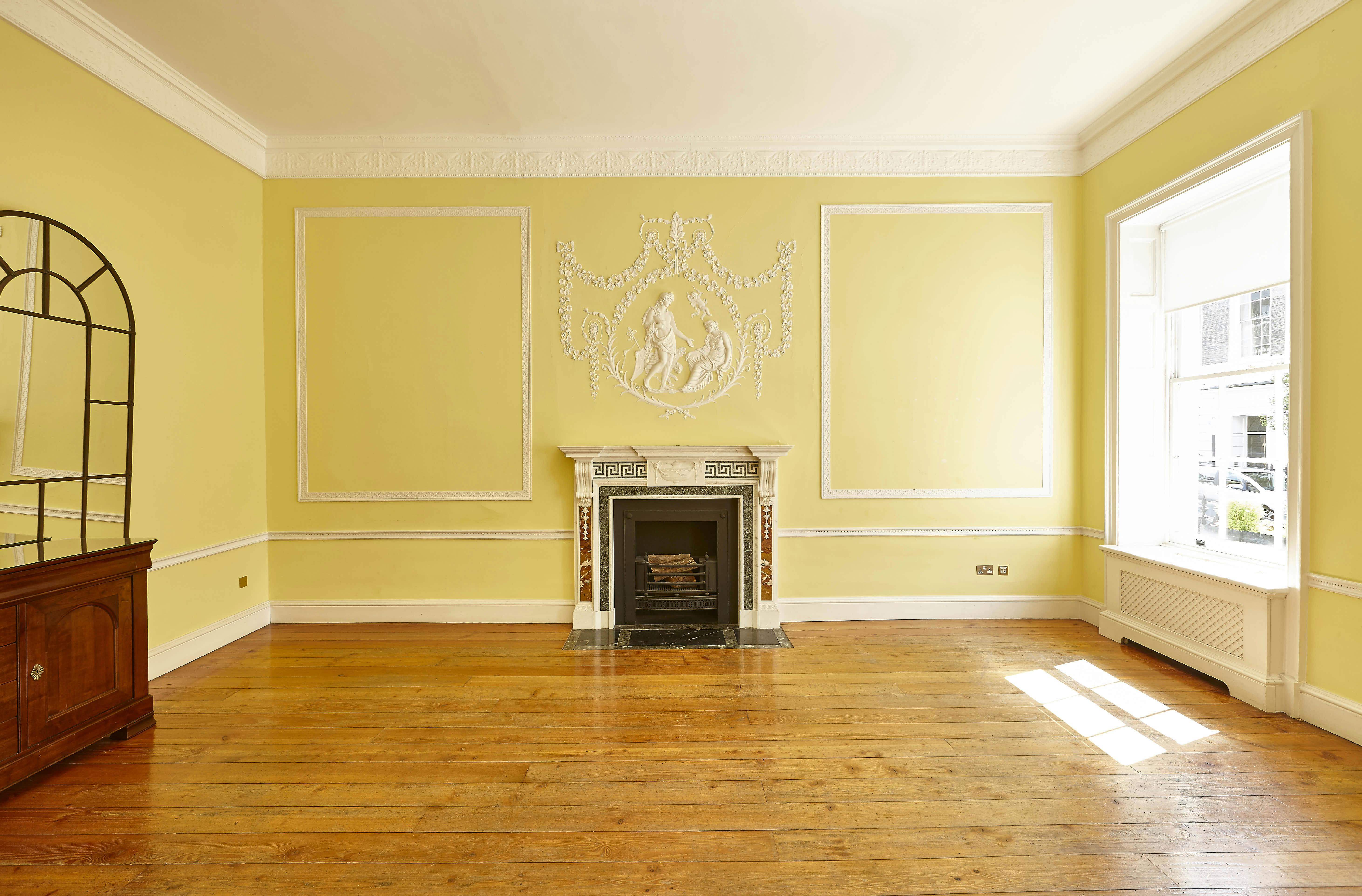 Elegant Hutchison Room with yellow walls, perfect for meetings and receptions.