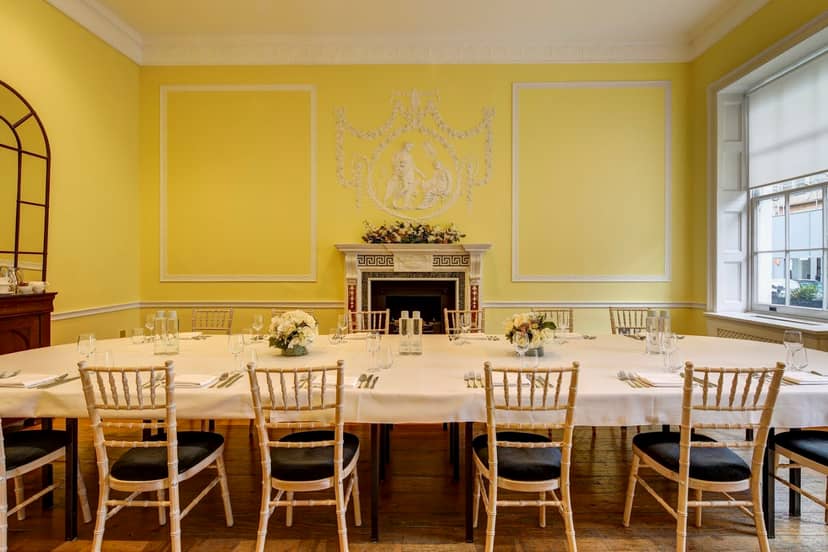 Elegant meeting room in Asia House with floral centerpieces, ideal for events and gatherings.