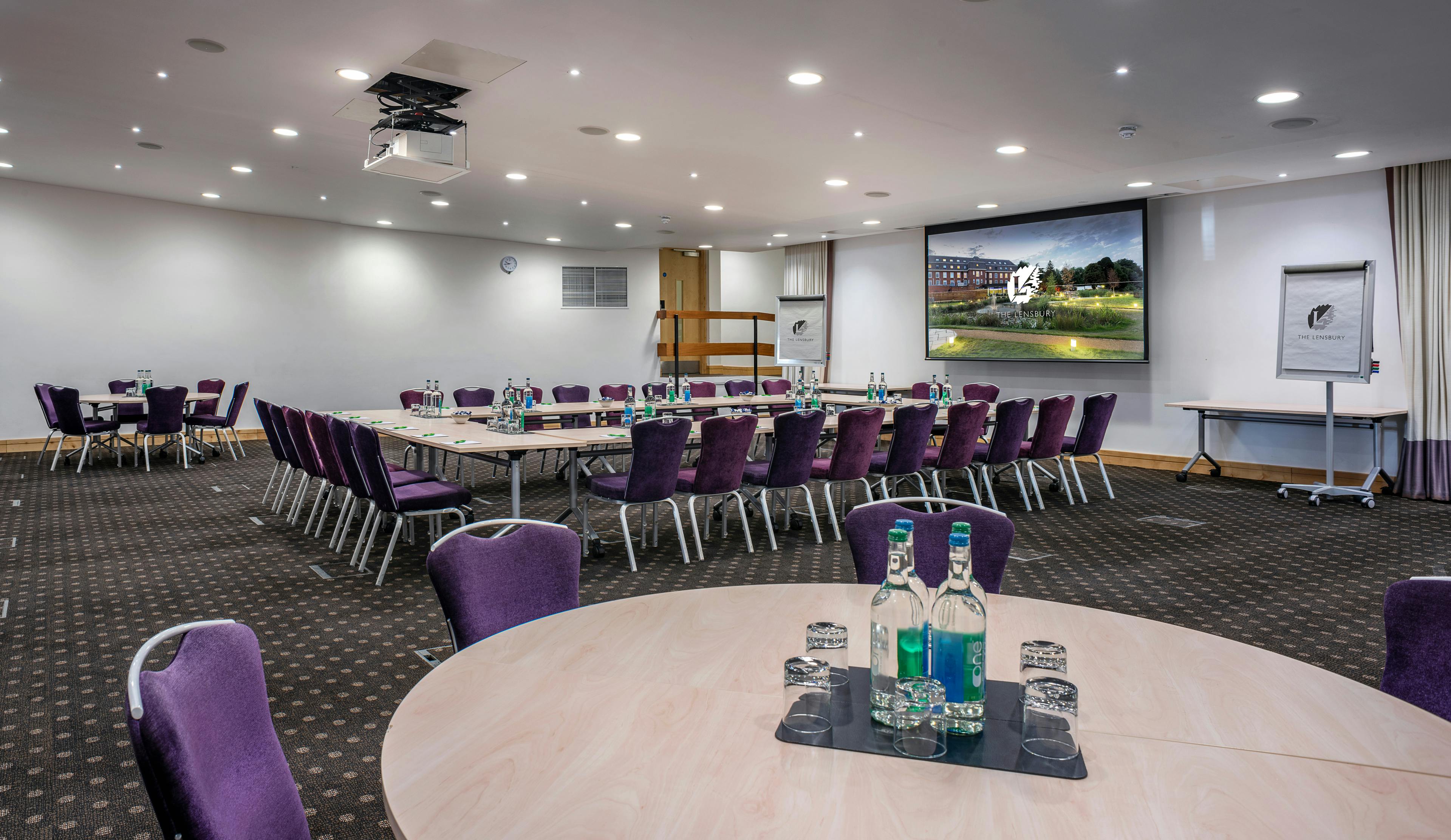 Beaumont Room at The Lensbury: versatile meeting space with large screen for workshops.