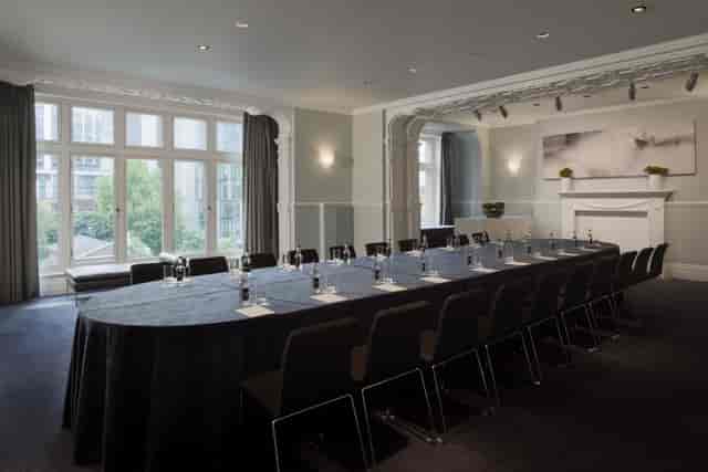 Elegant meeting room at Andaz London with oval table, ideal for corporate events.