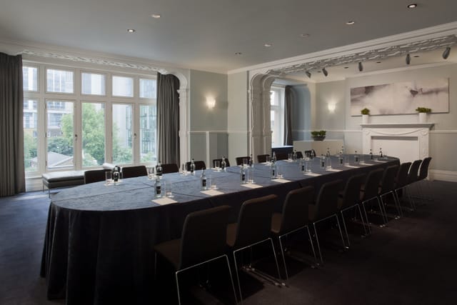 Elegant meeting room at Andaz London with oval table, ideal for corporate events.