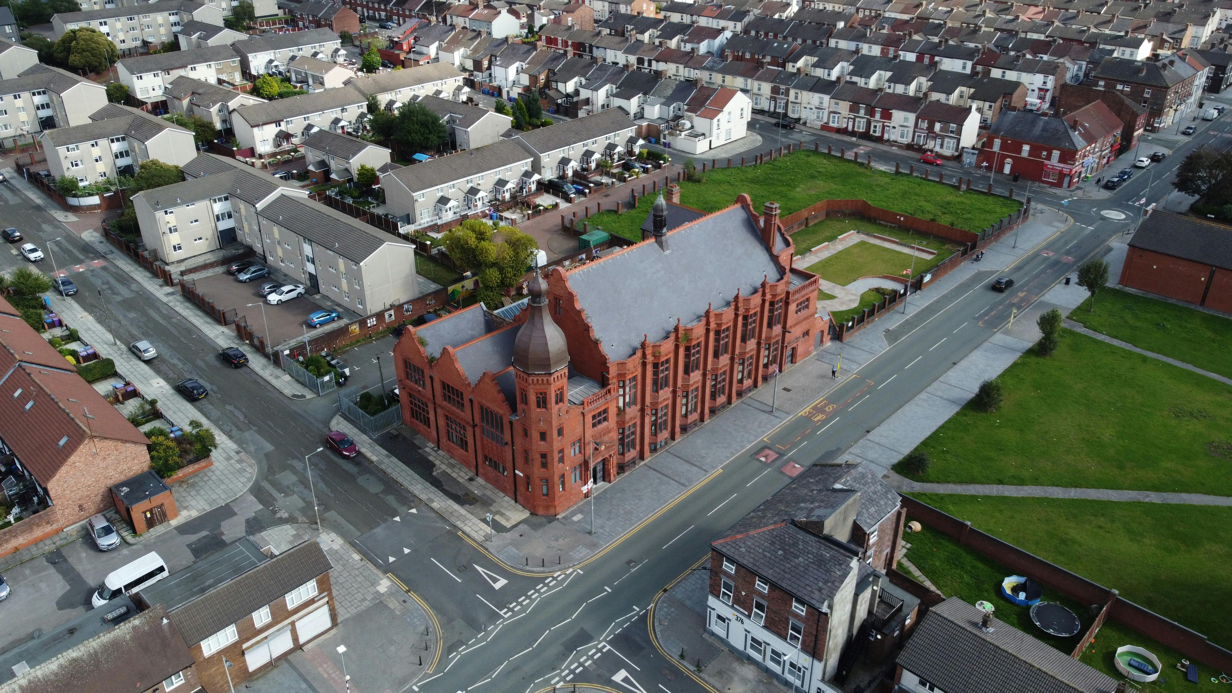 Red-brick Florrie venue ideal for events, surrounded by green space and residential areas.