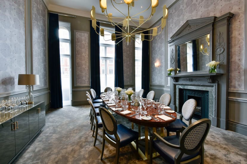 Elegant meeting space at Andaz London with polished table for corporate events.