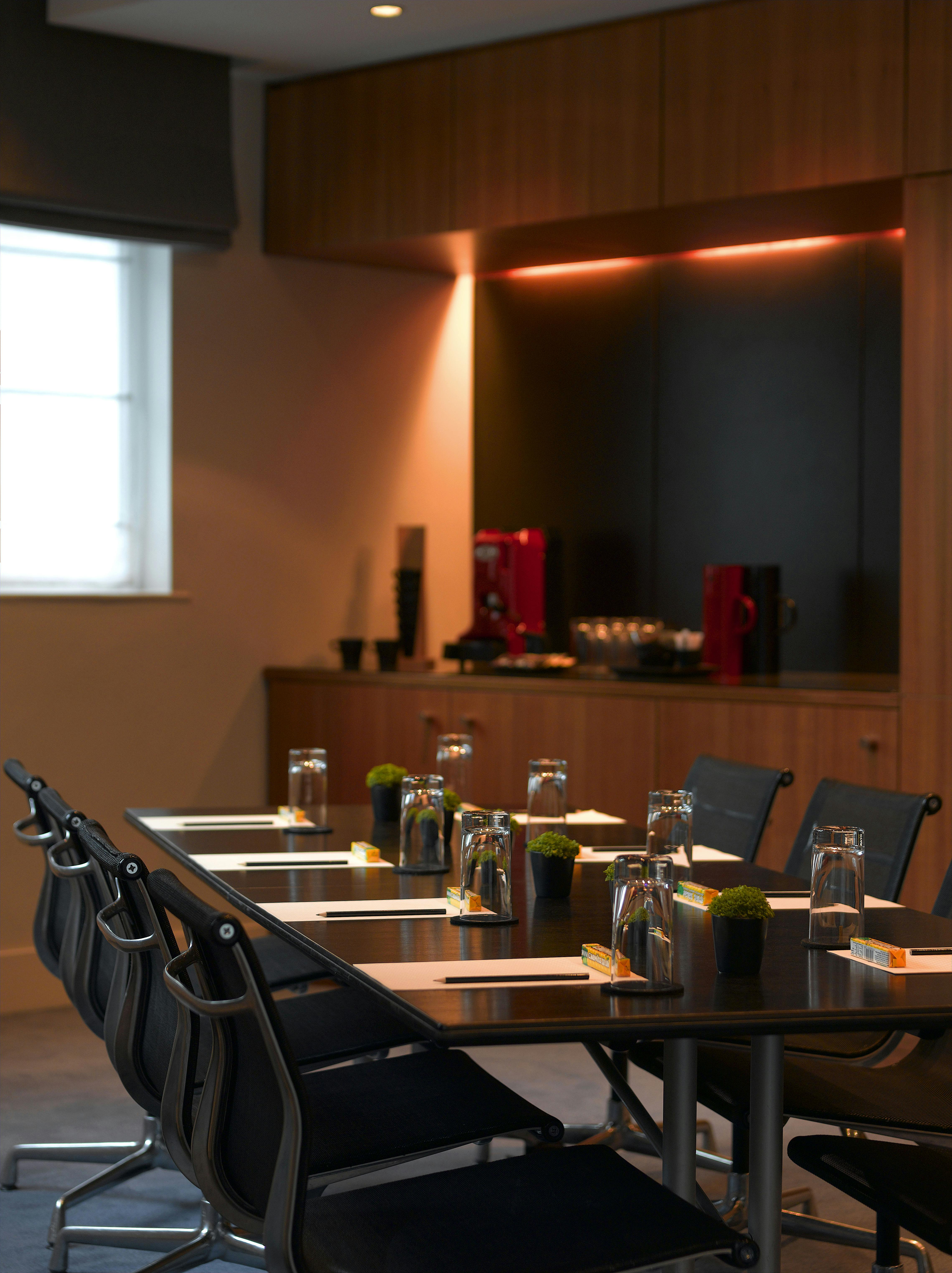 Broadgate Suite meeting room at Andaz London, featuring sleek table and corporate amenities.