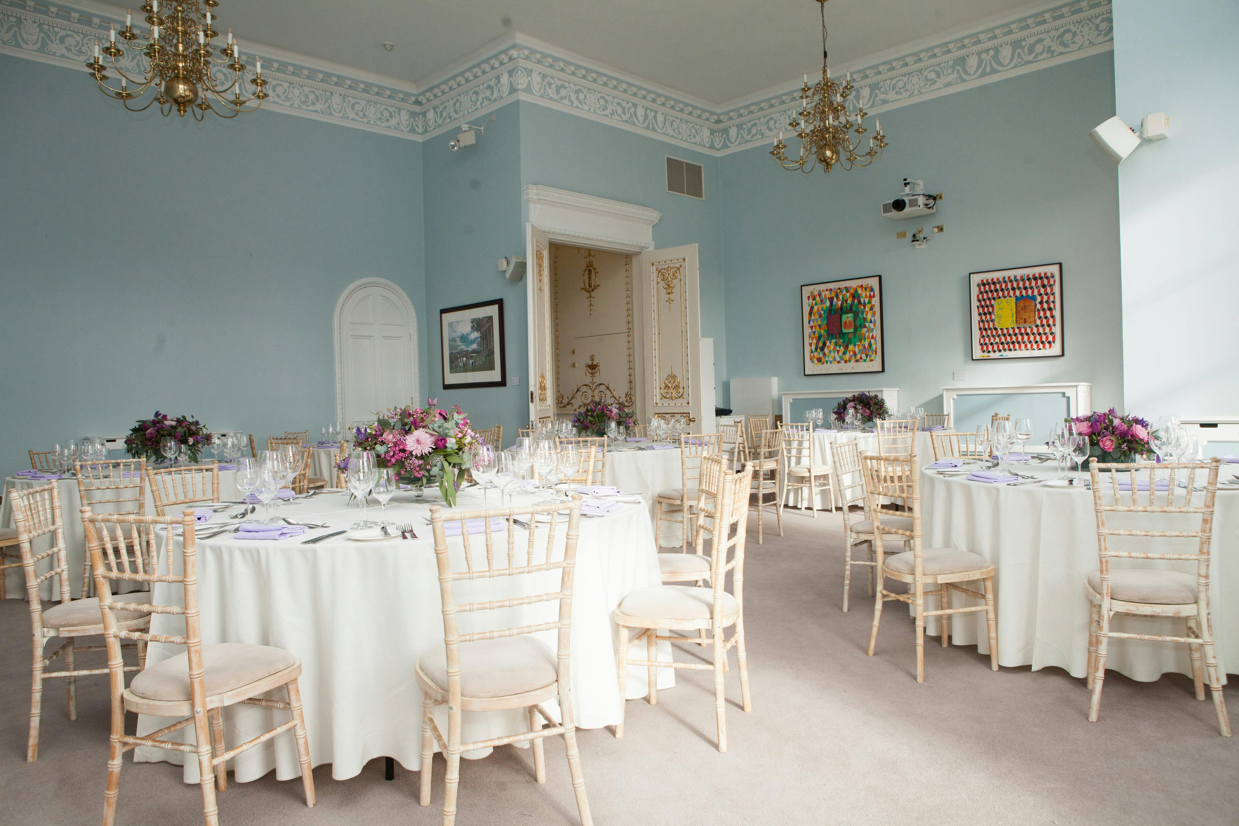 Beatrice Webb Room: elegant event space with floral centerpieces, ideal for weddings and corporate events.