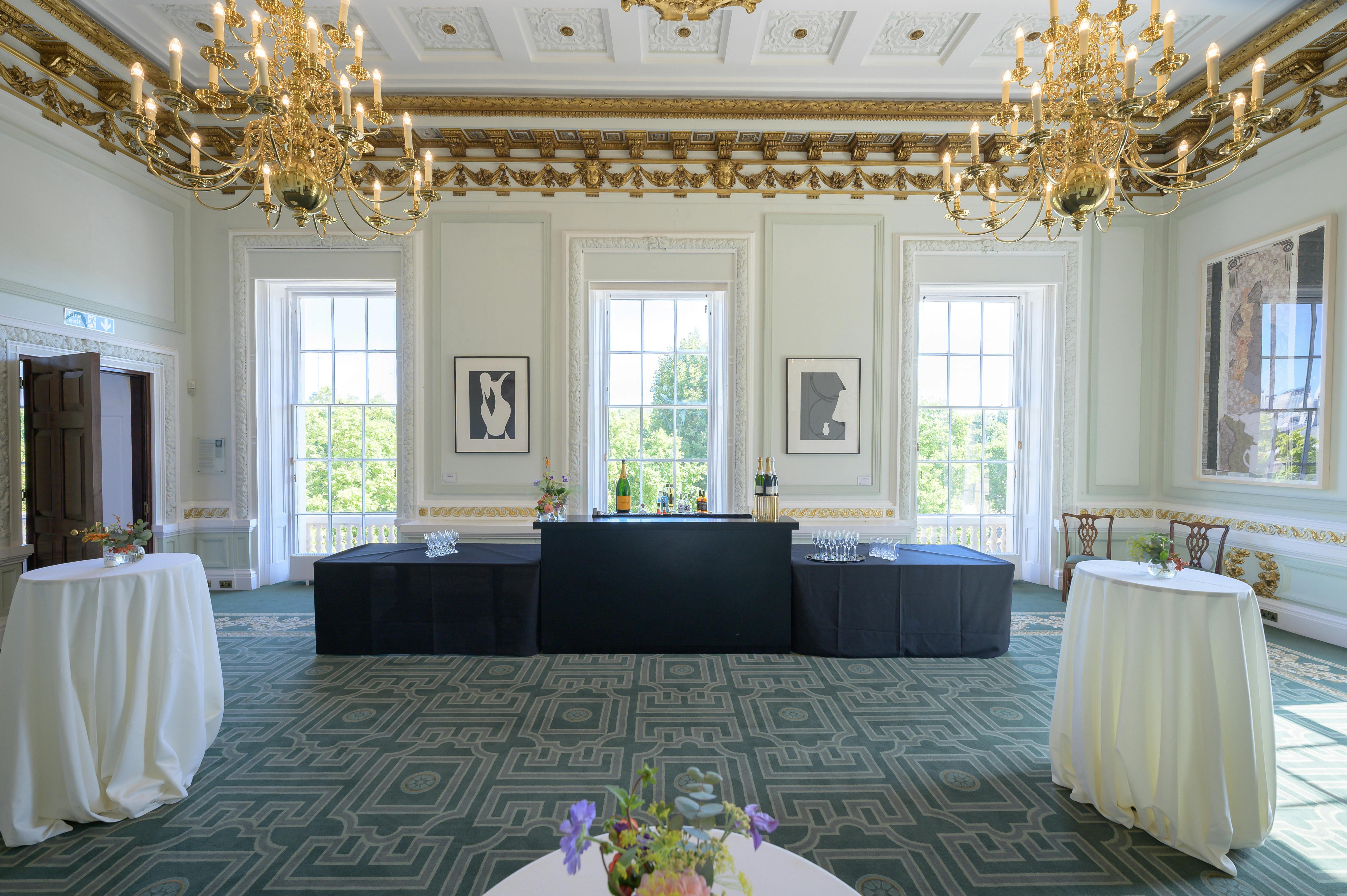 Elegant Radhakrishnan Room with chandeliers, perfect for networking events and receptions.
