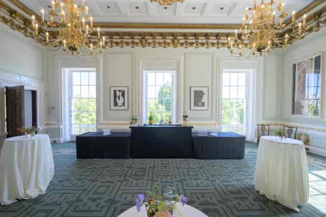 Elegant Radhakrishnan Room with chandeliers, perfect for networking events and receptions.