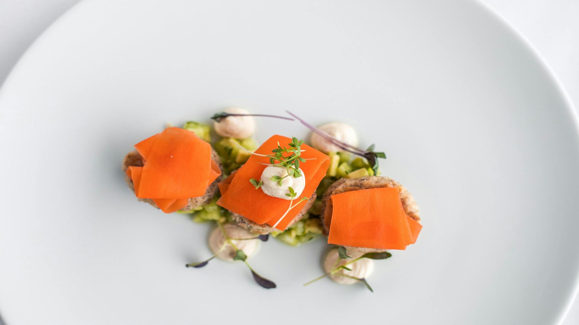 Pavilion Suite 3 dish at Ascot Racecourse: gourmet meat with vibrant garnishes for upscale events.