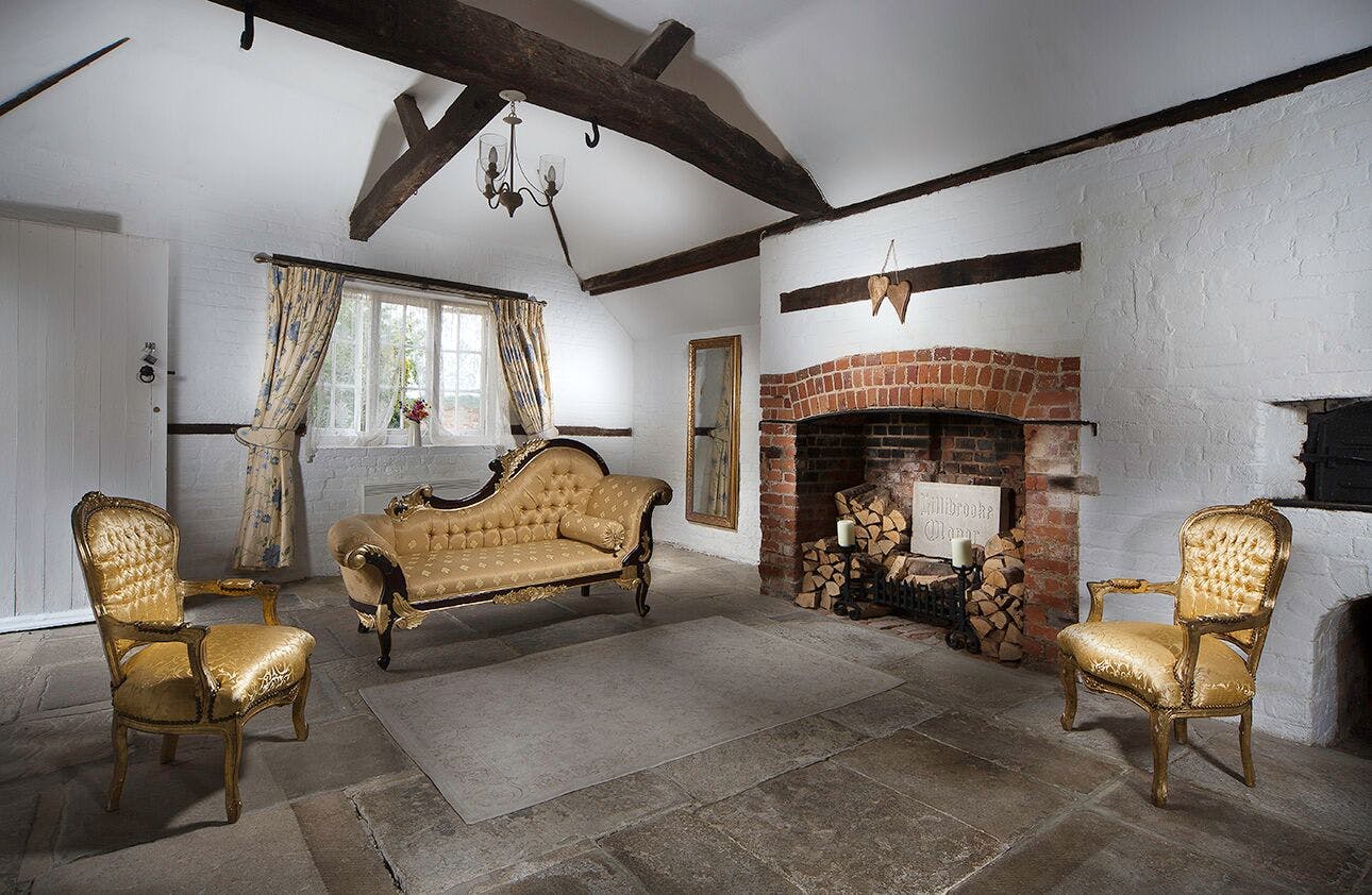 Cottage Room at Lillibrooke Manor: rustic meeting space for workshops and retreats.