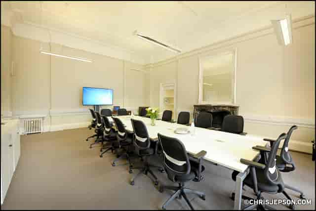 Modern conference room in SCI Belgravia with ergonomic chairs for corporate events.