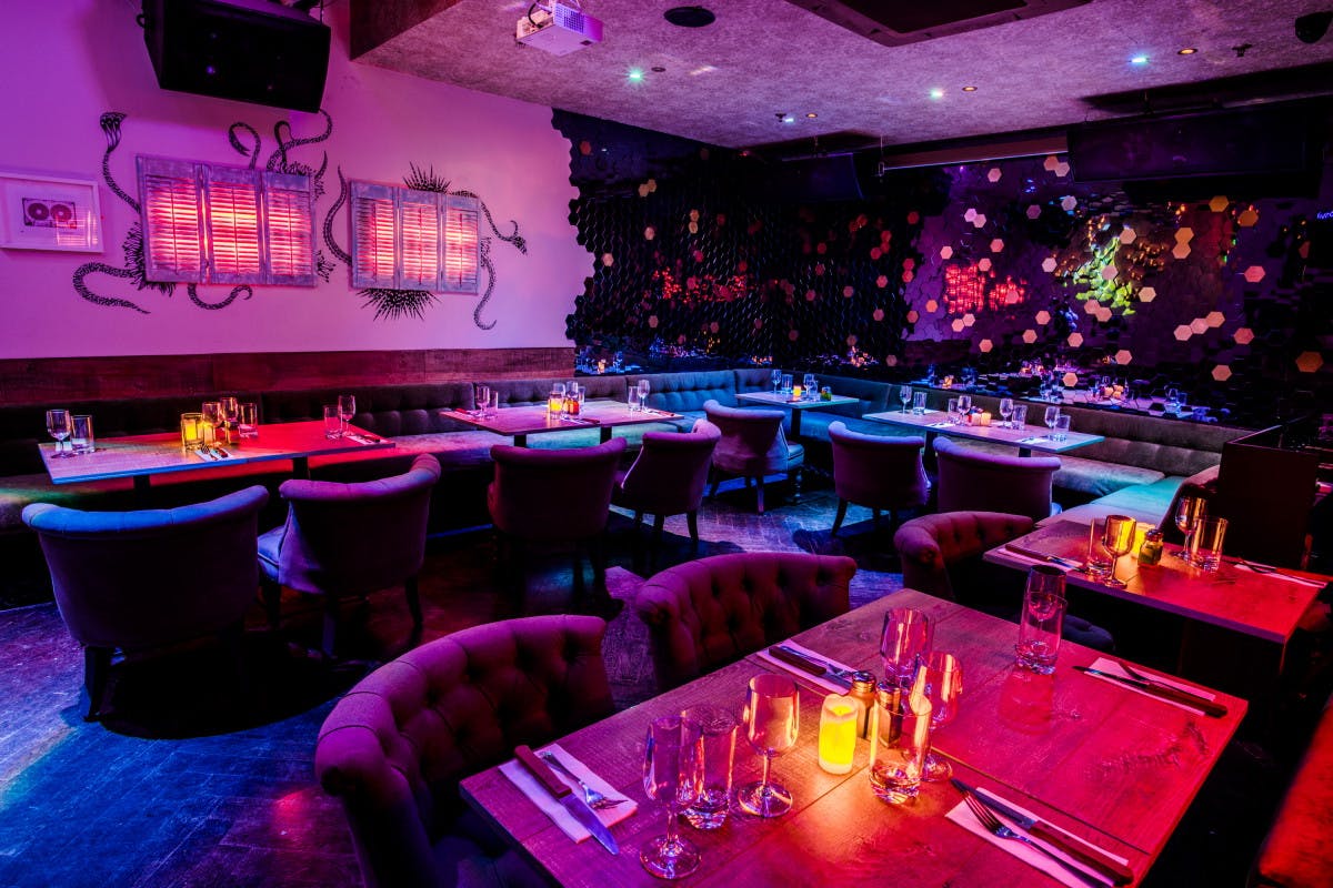 Vibrant event space at Chinawhite with stylish seating for networking and gatherings.