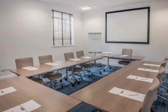 U-shaped meeting room at De Vere West One for corporate training and board meetings.