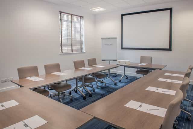 U-shaped meeting room at De Vere West One for corporate training and board meetings.