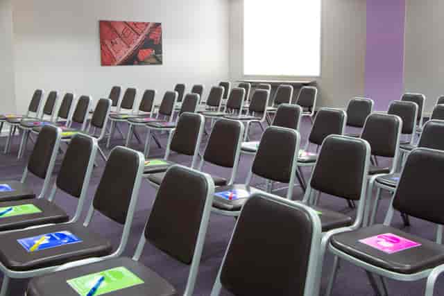 Theater-style meeting room setup in De Vere Canary Wharf for seminars and workshops.
