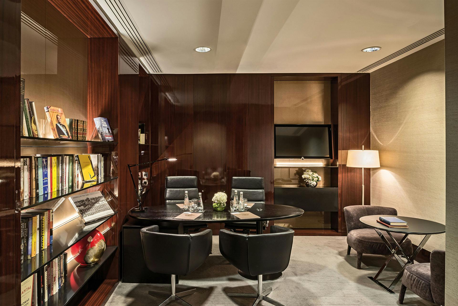 Private office meeting room at Bulgari Hotel London, featuring warm wood finishes and modern design.