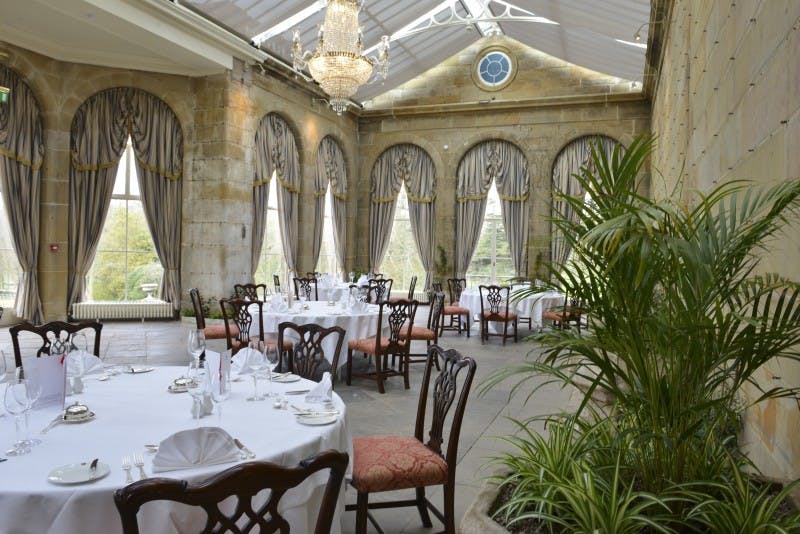 Victorian Orangery at Weston Park, elegant dining setup for weddings and corporate events.