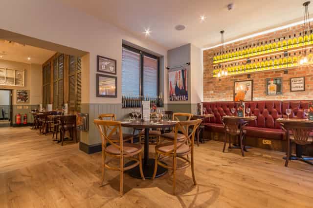 Stylish restaurant venue with warm lighting for intimate gatherings and corporate events.