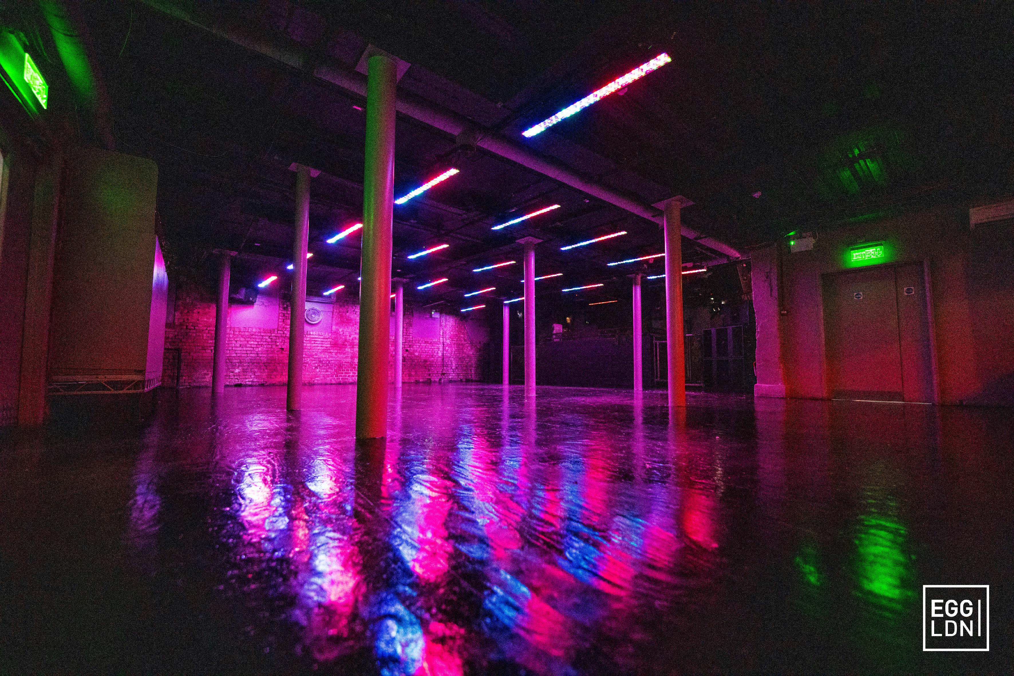 Vibrant event space with neon lights at Egg LDN, perfect for parties and gatherings.