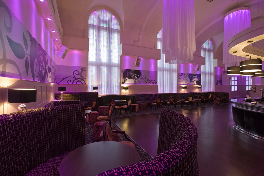 Chic event space at O2 Academy Bournemouth with ambient purple lighting for upscale gatherings.